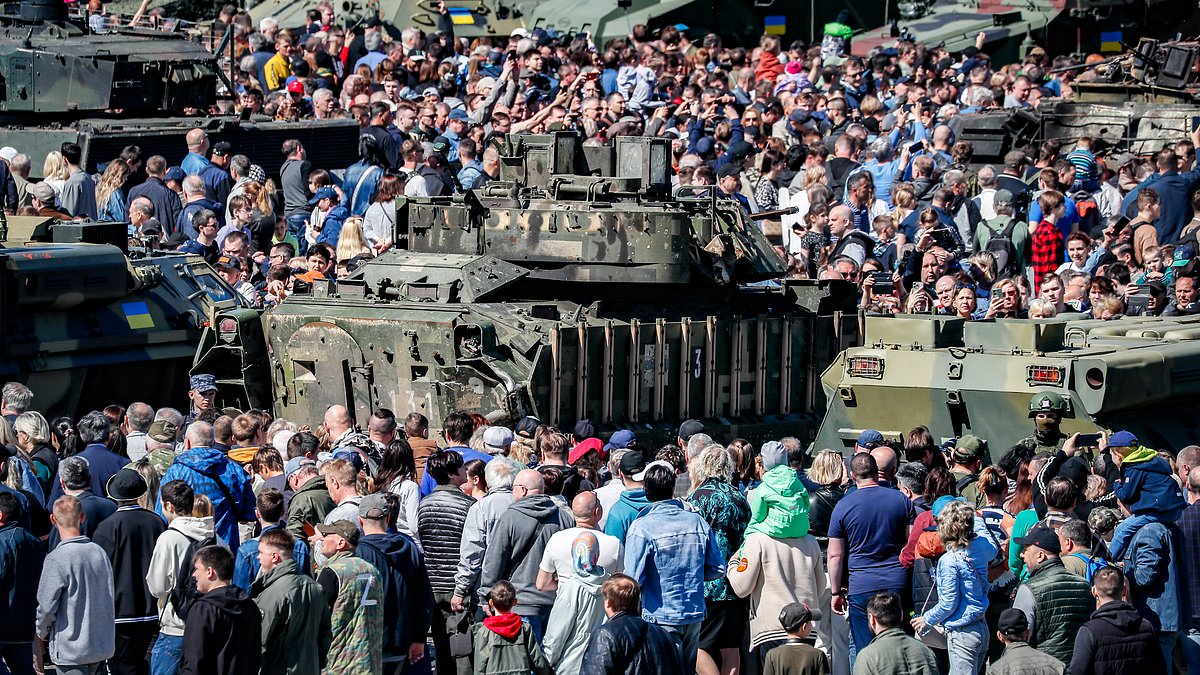 Russians descend on Moscow's Victory Park to goggle at captured Western military hardware including British ar - Daily Mail
